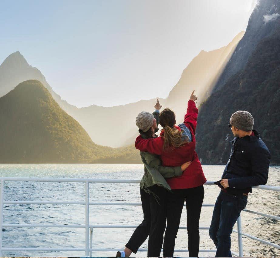 Group of people on a boat cruise in Milford Sound in New Zealand