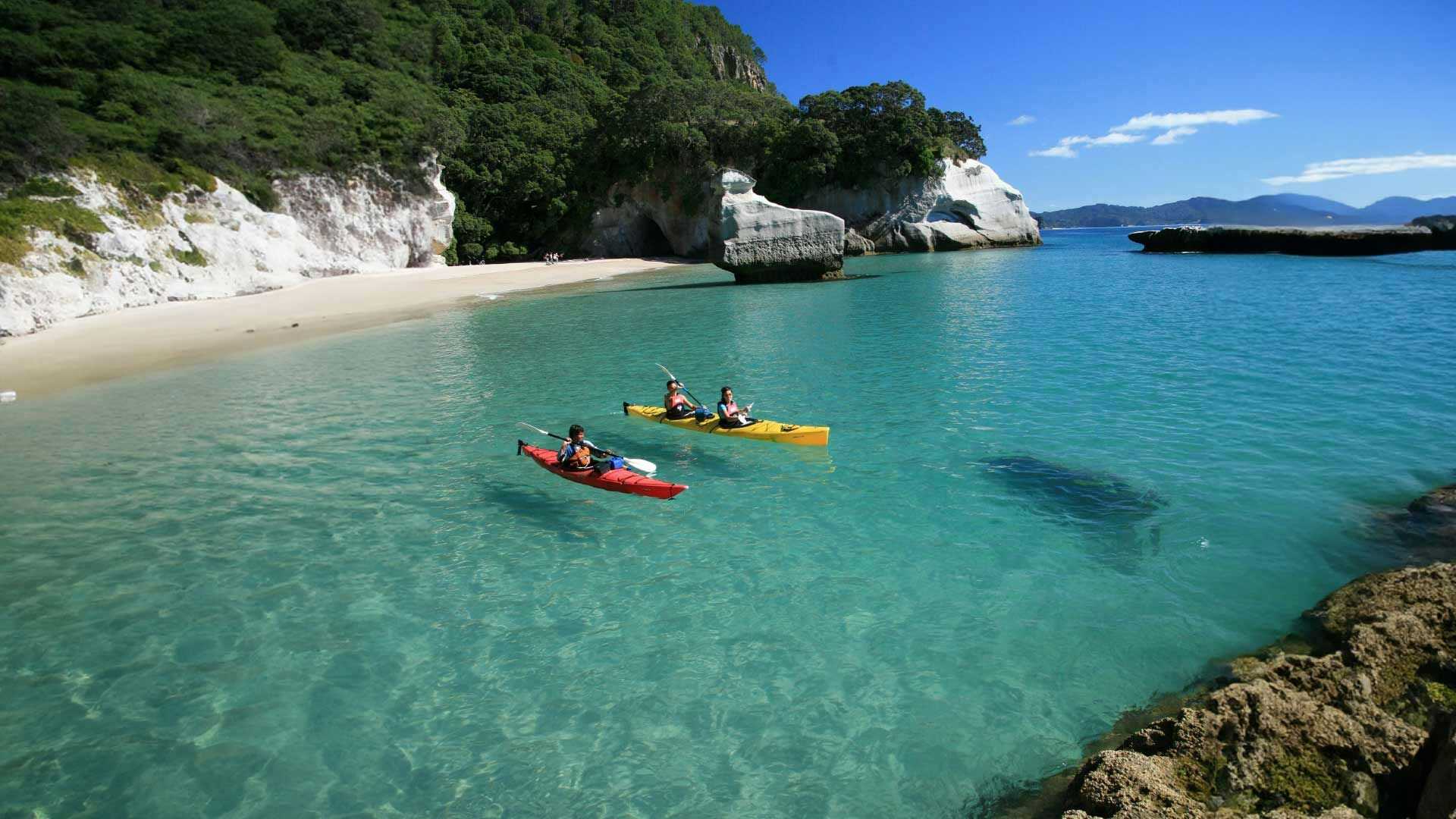 Two people kayaking at Cathedral Cove