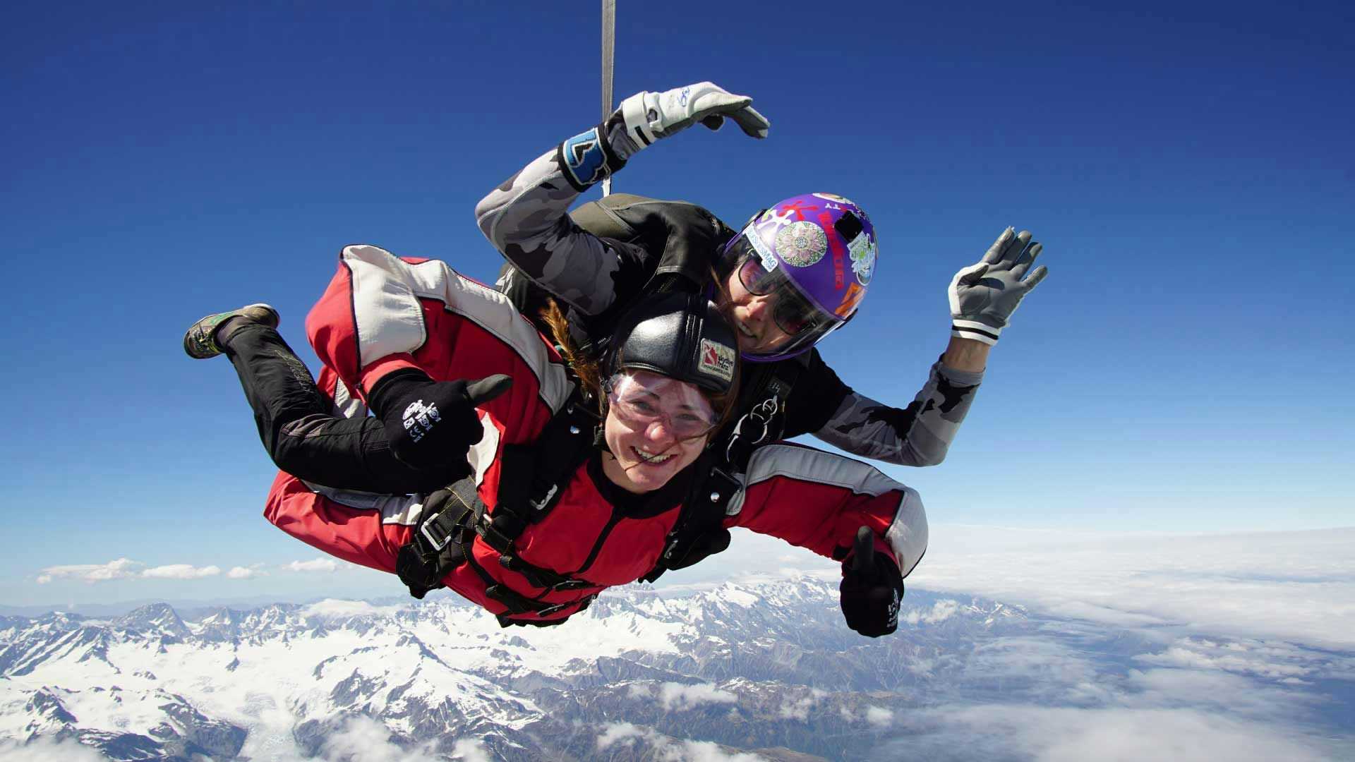 Two people tandem skydiving over Franz Josef