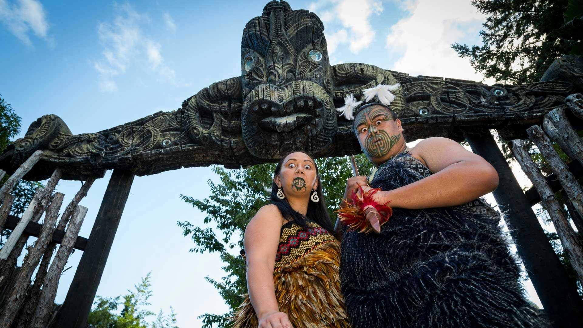 Maori man and woman pose for a photo
