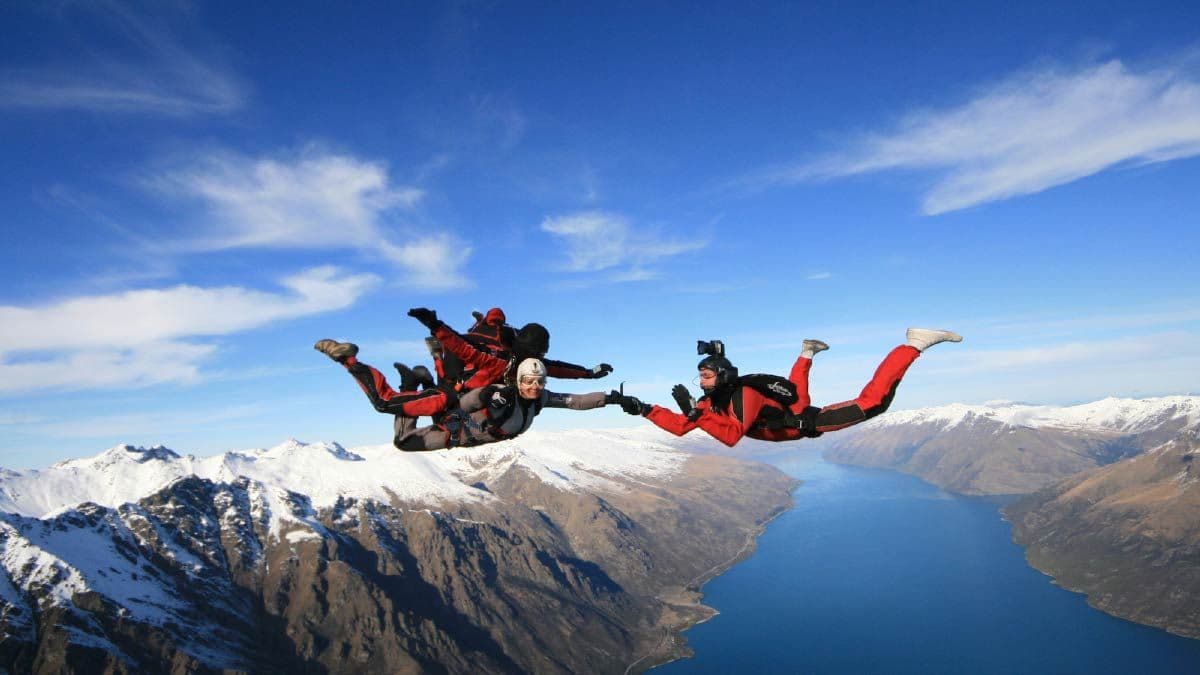 Tandem skydivers over Queenstown