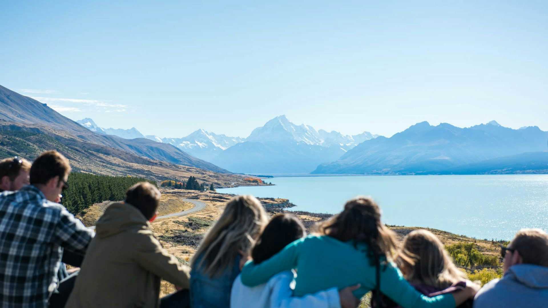Group of Wild Kiwi guests admire the view over Lake Pukaki