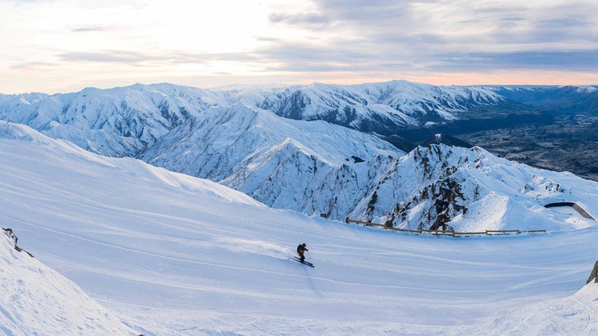 Person skiing down Coronet Peak
