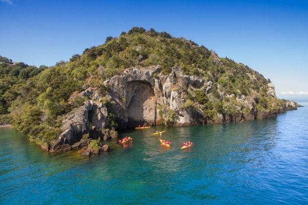 Wild Kiwi Guests Kayaking at Lake Taupo Exploring the Māori Rock Carvings