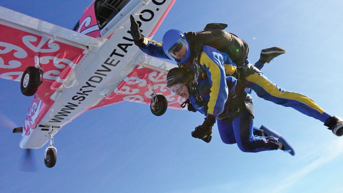 Person tandem skydiving over Taupo in New Zealand
