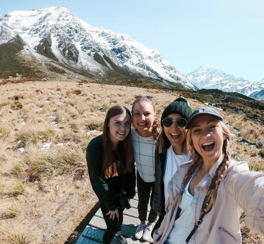 Four women posing for a photo in New Zealand