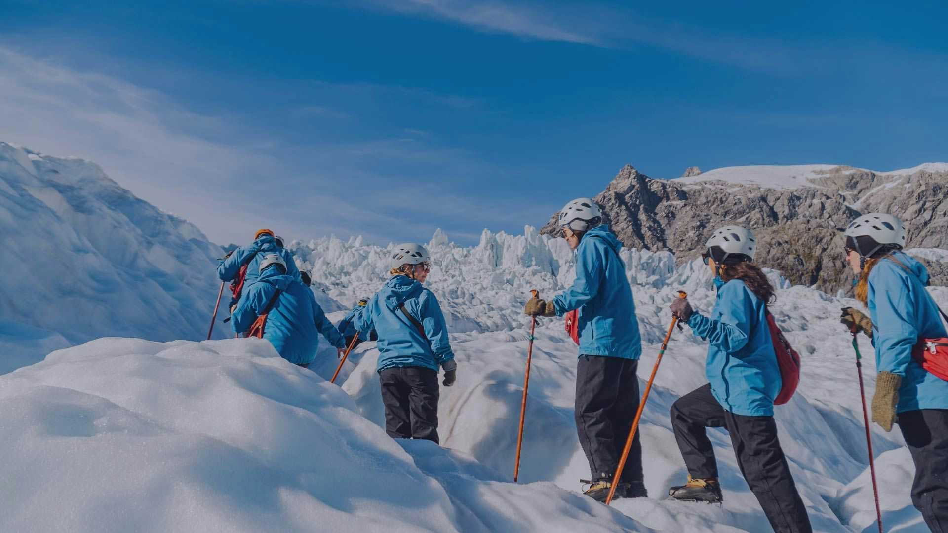 Group of people hiking on Franz Josef Glacier in New Zealand
