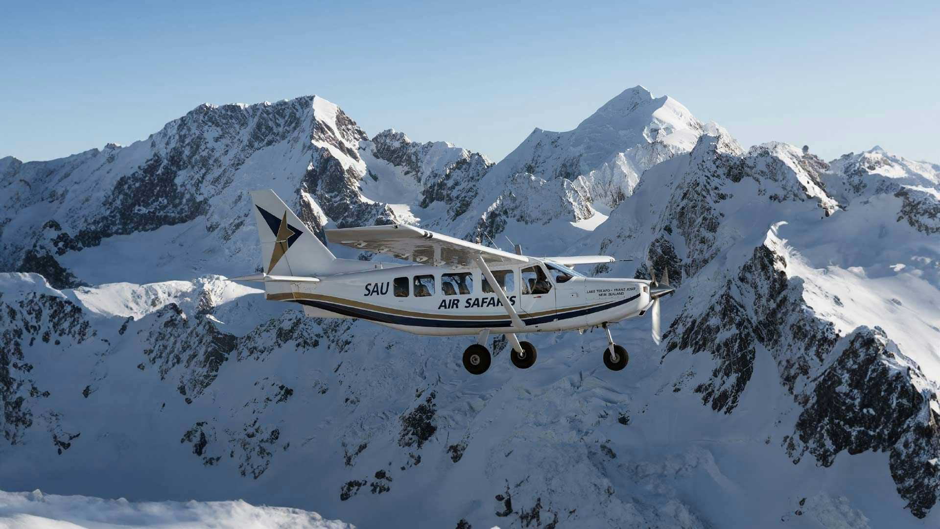 Small plane flying over the Southern Alps