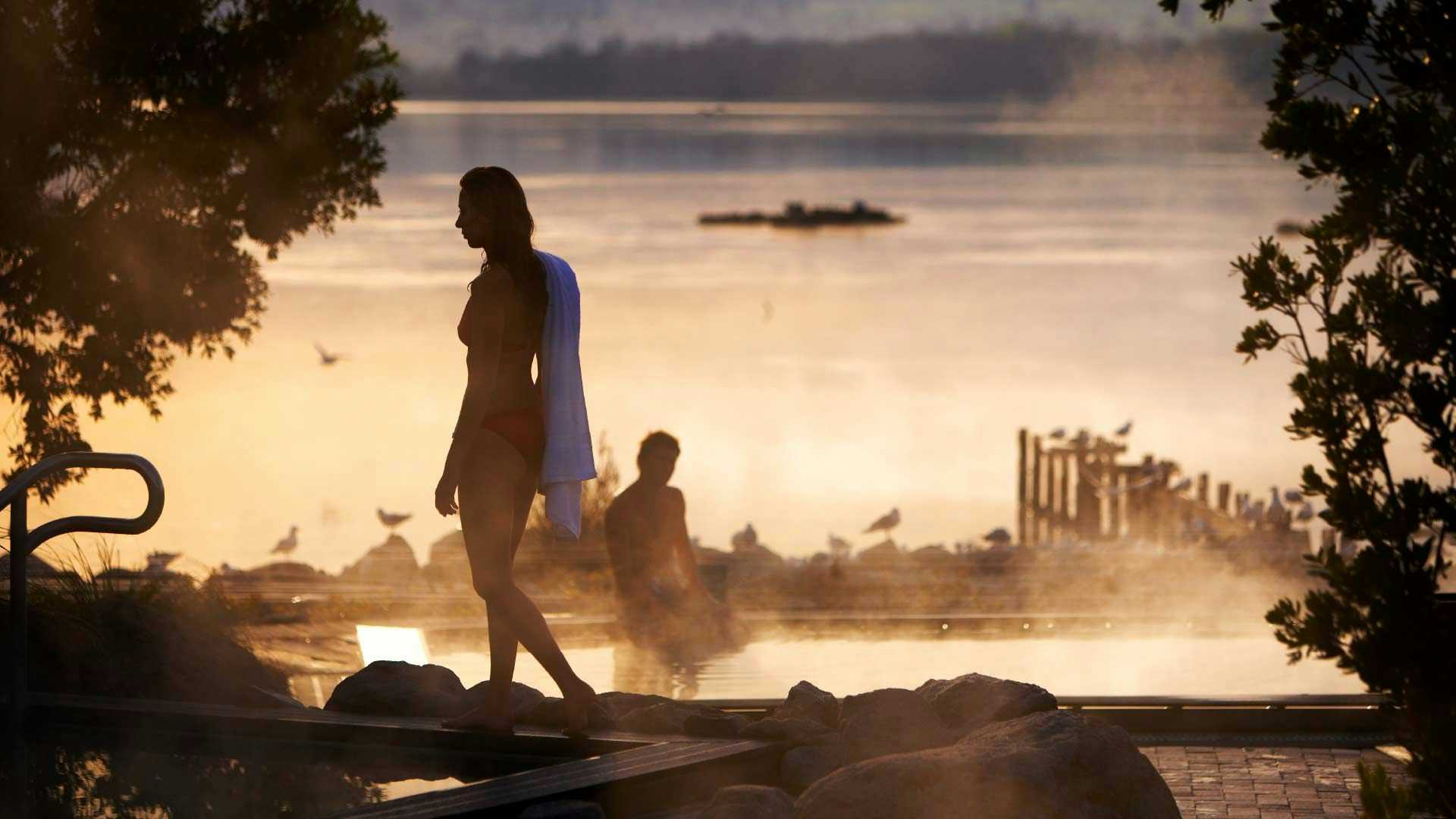 Woman at sunset in the thermal baths at Polynesian Spa