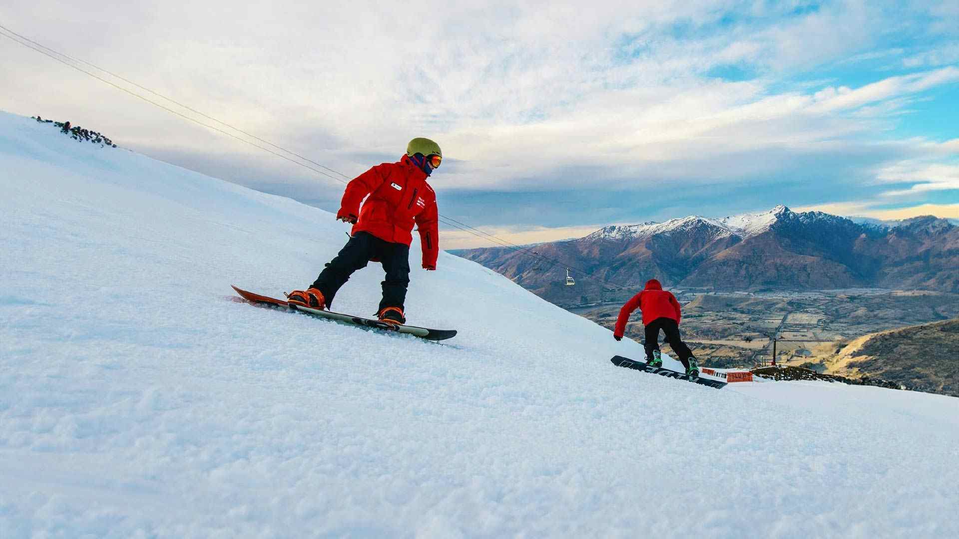 Person learning to snowboard at Coronet Peak in New Zealand