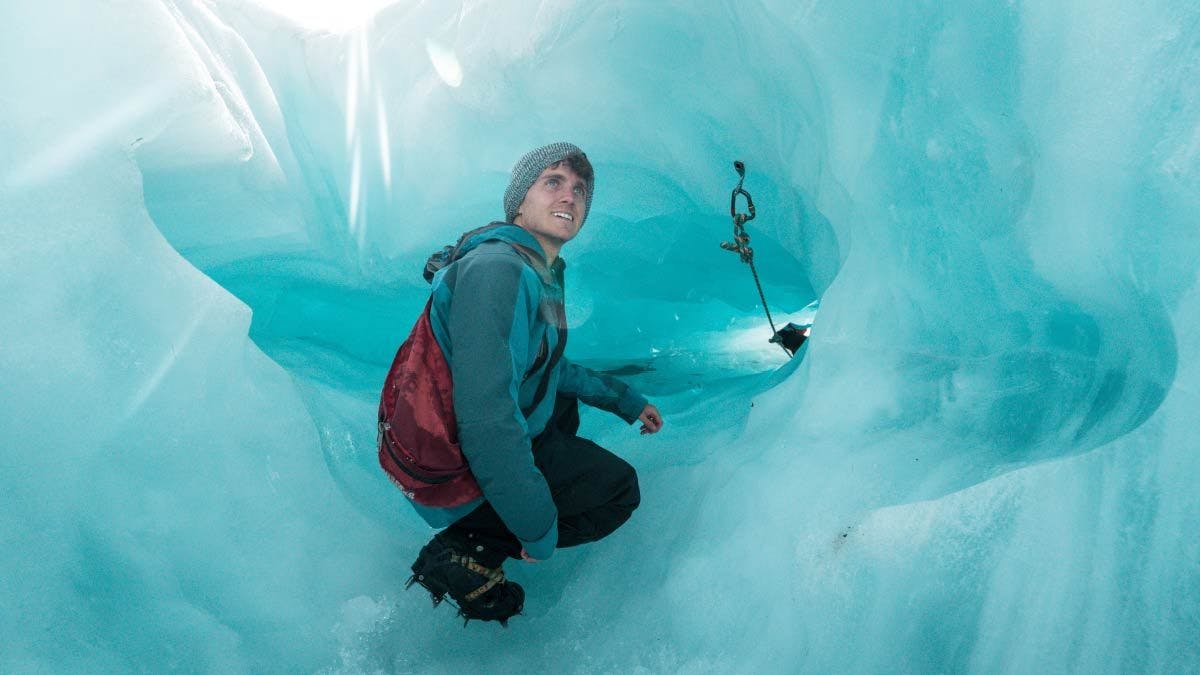 Man exploring Franz Josef glacier in New Zealand