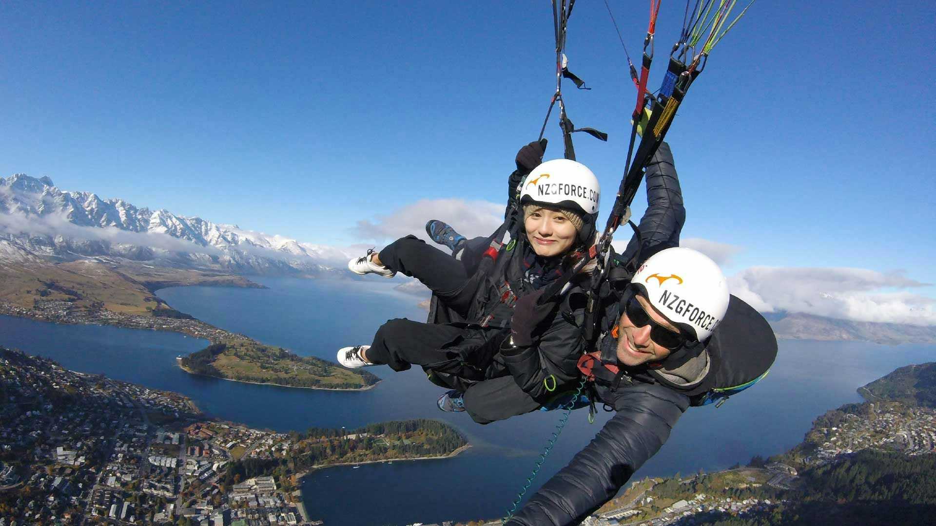 Two people tandem skydiving over Queenstown
