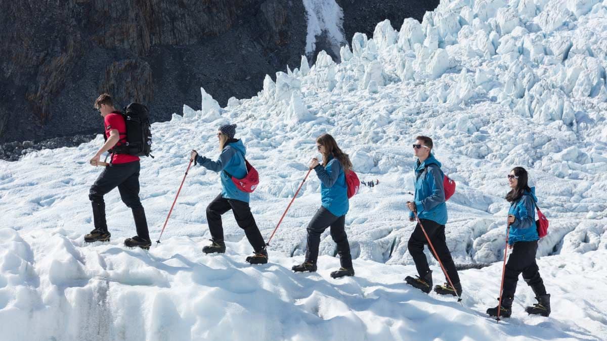 Group of people hiking on Franz Josef Glacier