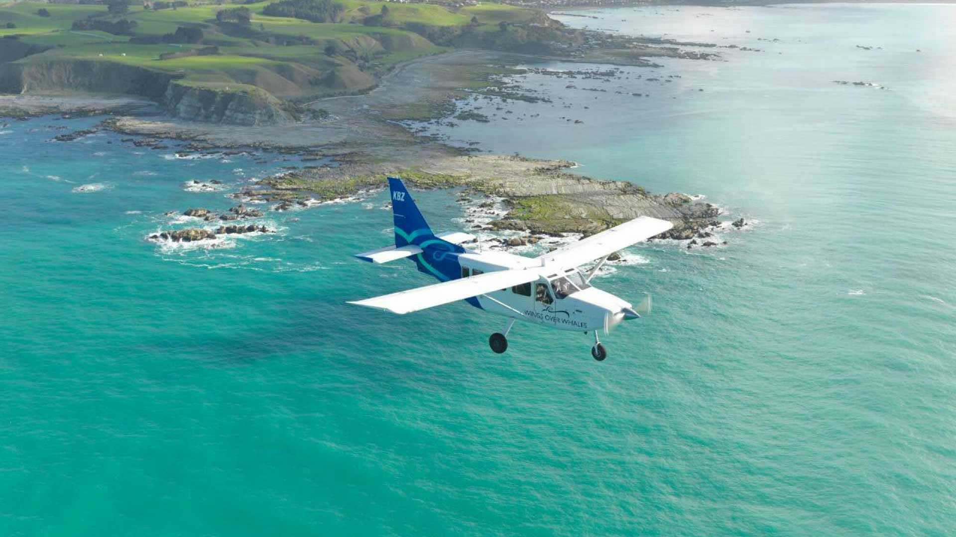 Small aircraft flying over the water in Kaikoura