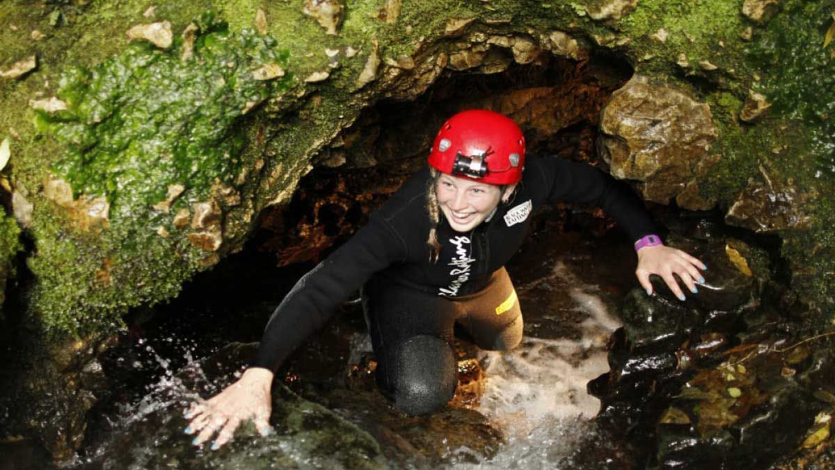 Woman exploring the caves at Waitomo