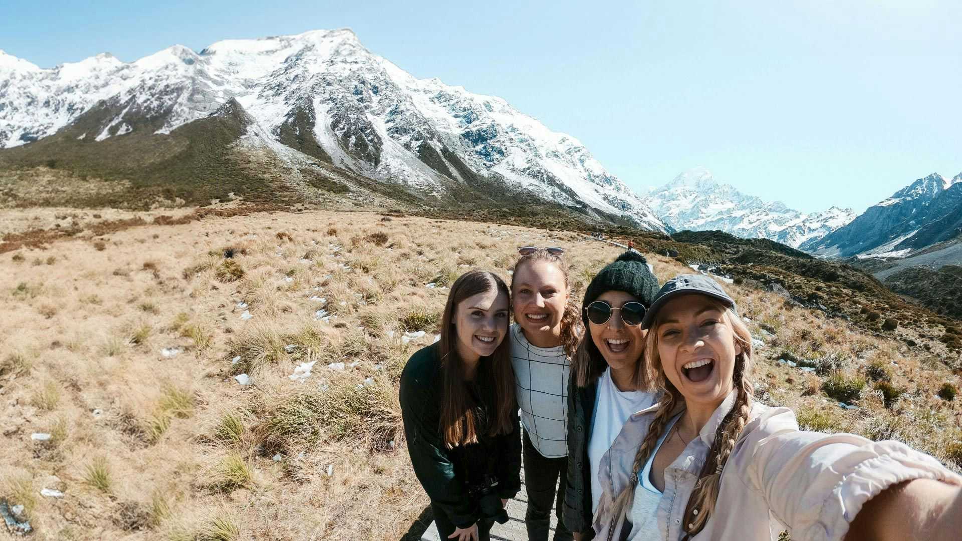 Group of people pose for a photo in New Zealand